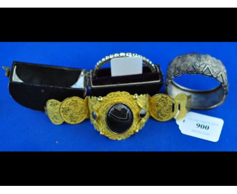 A late Victorian gilt metal and agate cuff, a silver bangle, and a paste set bracelet, boxed (3)