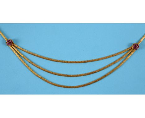 An 18ct yellow gold necklace, with textured links, set ruby flowerheads, approx. 31.2 g (all in)  See illustration