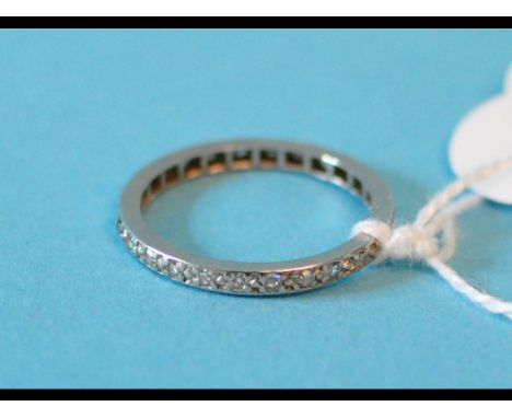 A diamond eternity ring, in a white coloured metal mount, approx. ring size M½
