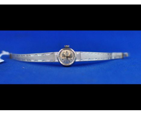 A lady's 18ct white gold Movado wristwatch, with baton indices Condition report Report by RB

The watch and strap are both 18