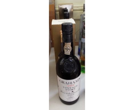 Two bottles of Graham's vintage port, 1977, a bottle of Dow's vintage port, 1975, a bottle of Johnnie Walker Gold Label whisk