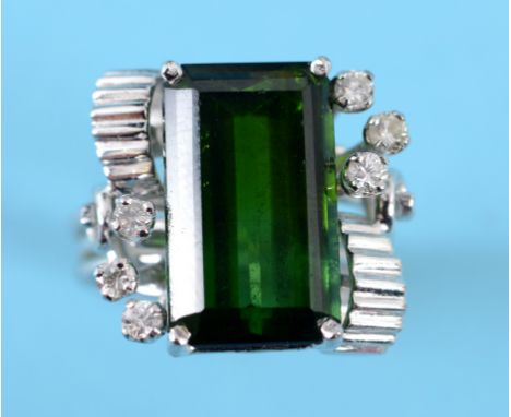 A white coloured metal, green spinel and diamond ring, approx. ring size K  See inside back cover colour illustration Conditi