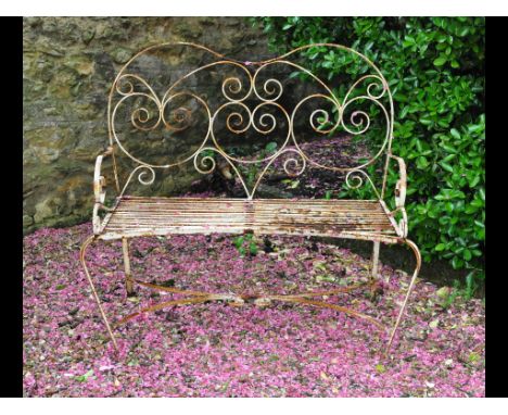 A wrought iron garden bench