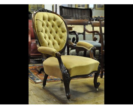 A carved walnut armchair, with an oval button back Condition report Report by GH

Several repairs. Strengthened between the b