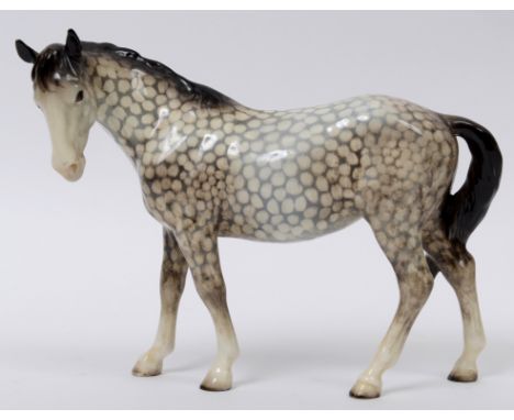 A Beswick Mare, facing left, rocking horse grey, 976, gloss  See illustration Condition report Report by NG

Mare crazed, mos