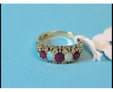 A Victorian style 9ct gold, opal and ruby ring, approx. ring size L½