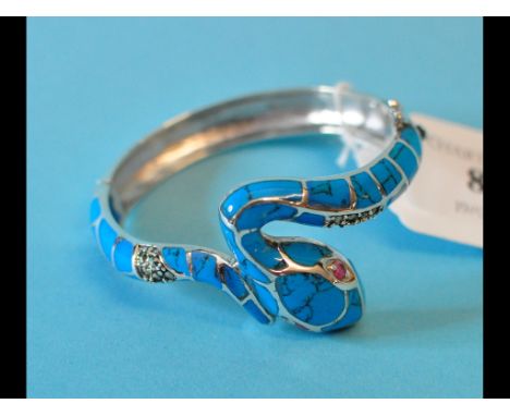 A silver and turquoise snake bangle