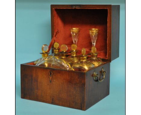 A 19th century Dutch mahogany decanter box, the interior fitted six decanters and stoppers, two glasses and a tray, 26 cm wid