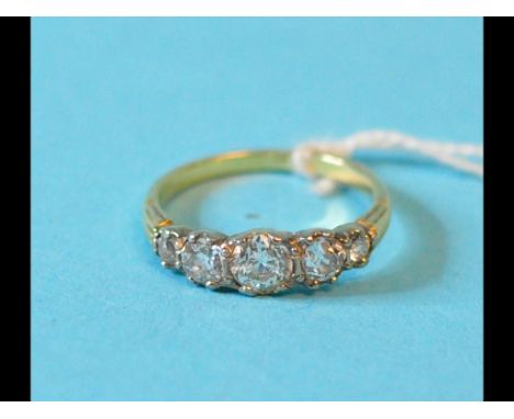 An 18ct gold and five stone diamond ring, approx. ring size M