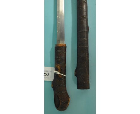 A Japanese short sword, having a 44 cm blade side, in a simulated wood scabbard, with matching handle, 86 cm long overall  Se
