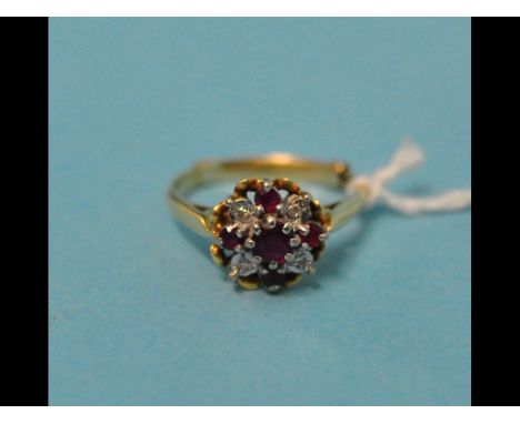 An 18ct gold, ruby and diamond cluster ring, approx. ring size L½
