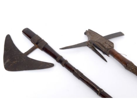 An African style axe, 79 cm long, and another axe, with carved decoration, 48 cm long (2)  See illustration