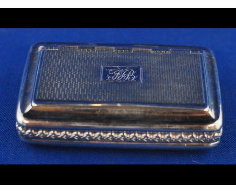 A George III silver snuff box, initialled, and with engine turned decoration, London 1810, approx. 2.8 ozt, 7.5 cm wide