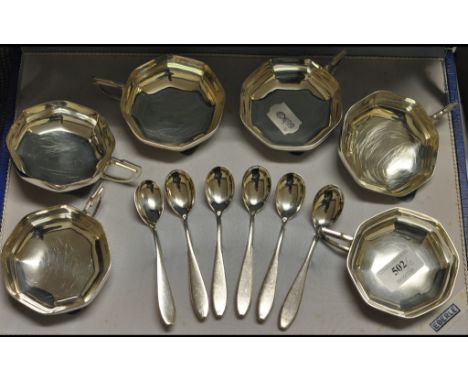 A set of twelve silver coloured metal and ceramic coffee cans and saucers, and a silver coloured metal fruit set (a.f.) (2)