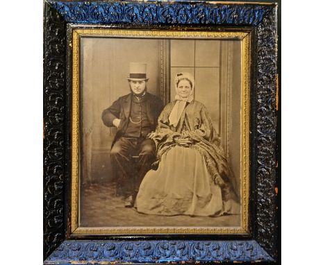 PHOTOGRAPHY. An enlarged portrait of a husband &amp; wife, probably advertising a photographic studio's service of offering e