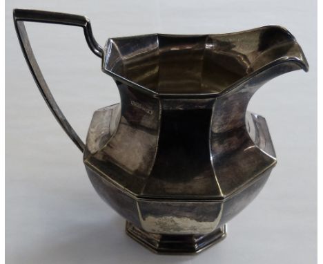 A silver cream jug London 1968, of panel form