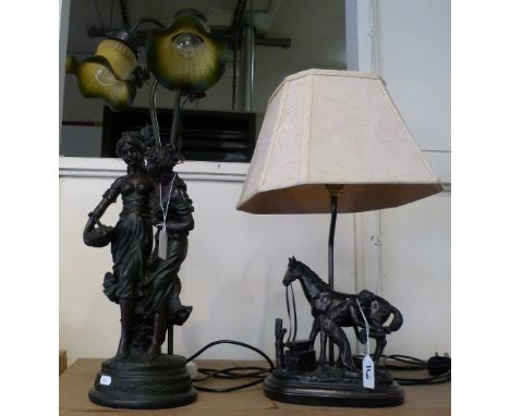 A twin branch table lamp with two bronzed females to the base together with another table lamp with bronzed blacksmith to the