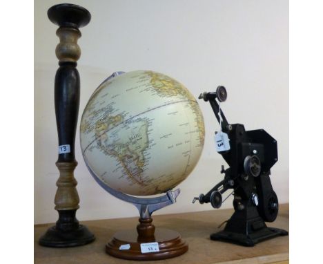 A modern globe on wooden stand together with a turned wood candlestick and Pathescope projector (3)