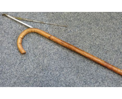 A walking stick with integral horse measuring stick