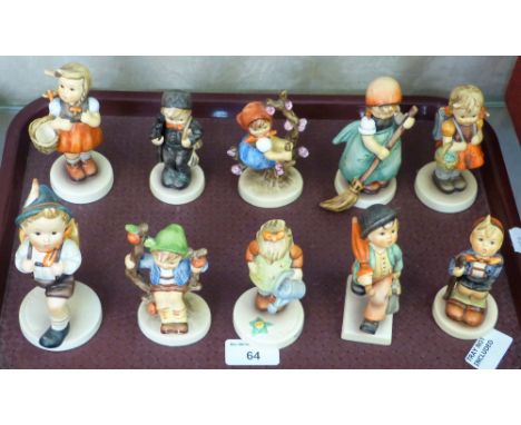 A collection of ten Goebel Hummel figurines with boxes