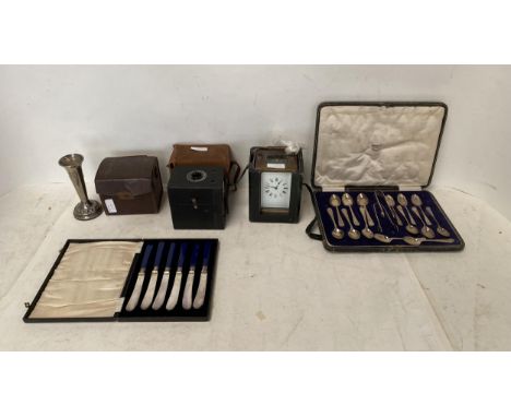 Two vintage cameras, I carriage clock, and a quantity of silver plate and EPNS knives, cased, all as found 