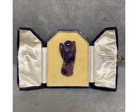 Carved amethyst model of a parrot with intagio stamp to base, in a James Ogdon and Sons fitted box, 