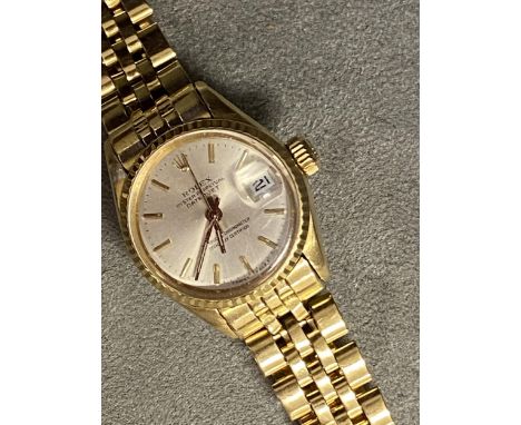 ROLEX, ladies oyster perpetual date just, superlative chronometer, on a Rolex oyster 18ct gold bracelet strap, 22mm, face wit