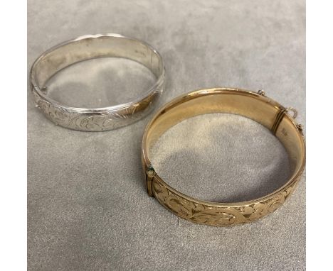 Sterling silver bangle together with a 9 ct gold  plated example 