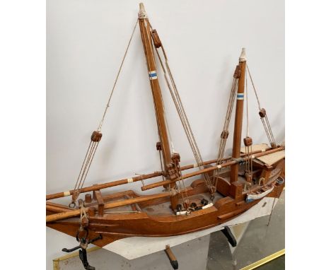 Cased model of a masked boat &amp; another uncased,  &amp; pair of bellows. Condition: both with much wear 