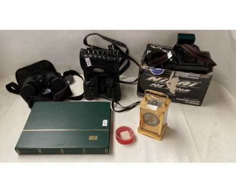 Quantity of stamps in album, camera, binoculars, carriage clock etc, all as found 