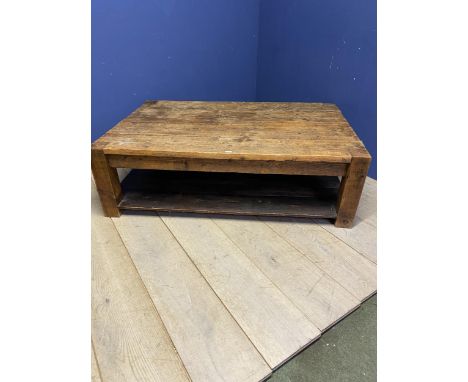 A rustic  style two tier low centre table, 4 plank top, with shelf under 149 x 97 x 46 cm H 