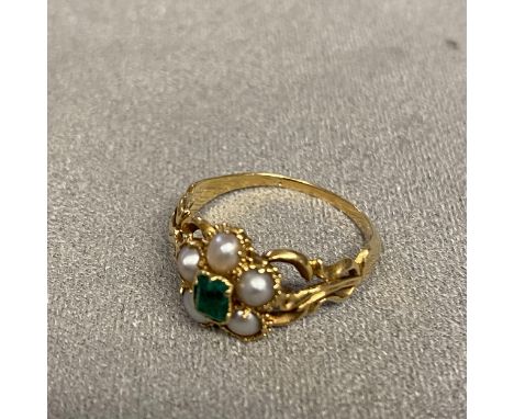 Unmarked C19th yellow metal emerald and split pearl mourning ring, with quartz panel to reverse, central step cut emerald wit
