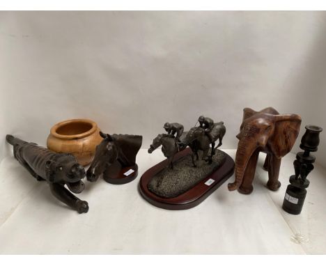 Bronze model of Arkle, wooden elephant, and model of racehorses on wooden plinth 