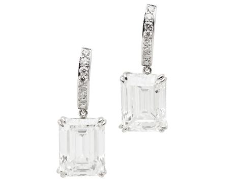 A pair of diamond set pendant earrings  each claw set with an emerald cut diamond, the bale set with eight small round brilli