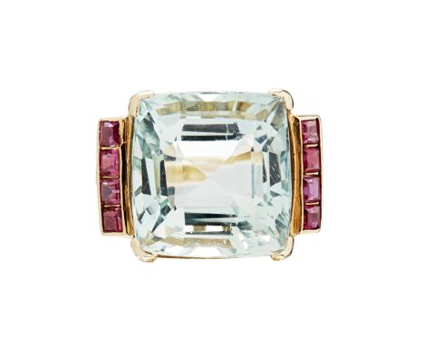 An aquamarine and ruby set cocktail ring  the square mixed cut aquamarine flanked to either side by four bezel-set square cut