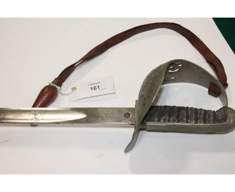 AN OFFICERS SWORD. An 1897 pattern officers sword with GvR under a crown on the 32.1/4" blade. Complete with sword knot and f