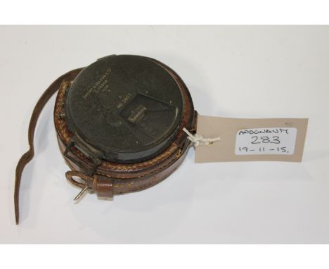 A CASED MILITARY COMPASS DATED 1906
