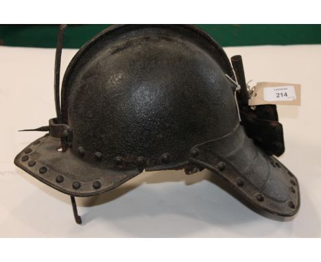 A LOBSTERTAIL HELMET. A 17thC style helmet with high comb and sliding nasal bar. Plume holder at the rear  with rivetted tail