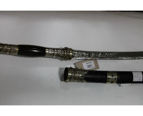 A BURMESE DHA. A decorative mid 20thC Burmese Dha, with horn hilt and silver coloured metal mounts. The single-edged 20" blad