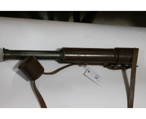 A TELESCOPE IN A FITTED CASE. A three drawer brass telescope by Broadhurst Clark of 63 Farringdon Rd, London EC. Brown leathe