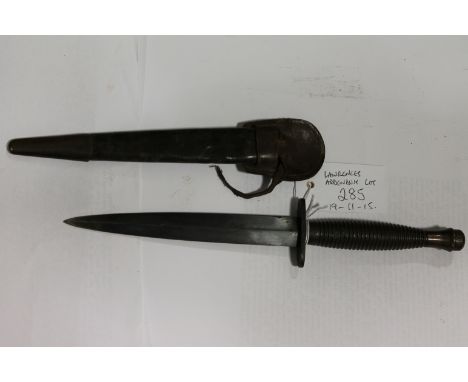 A COMMANDO DAGGER
A Commando dagger with straight quillion and broad arrow and 2, stamped above the guard. Cast hilt with sca