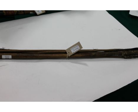 A NATIVE BOW & ARROWS. An African tribesmans bow with cord 55" long and five hunting arrows. 