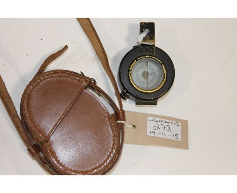 A CASED MILITARY COMPASS. A brass cased blackened military compass by T.G.Co.Ltd London , dated 1942 Mk 111. In its original 