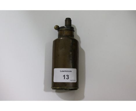 A PERCUSSION PISTOL FLASK. A three-way copper and brass percussion pistol flask, with two compartments in its base. These wou