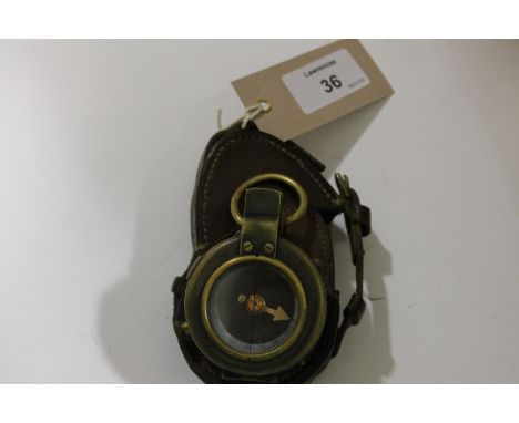 A MILITARY COMPASS. A brown leather cased Officers Compass dated 1917 , Verners pattern. The initials T G M are on the front 