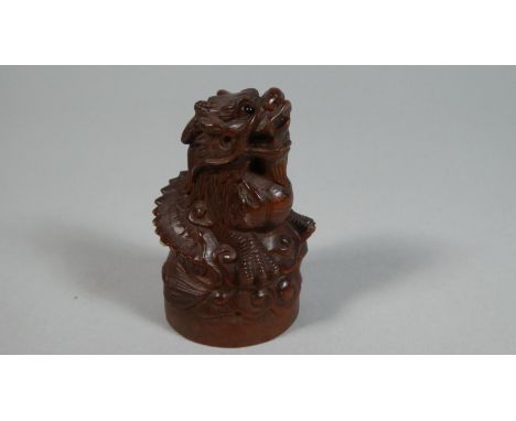 A Carved Wooden Netsuke in the Form of a Dragon, 6cm High 