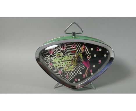 A 1960's Vintage Alarm Clock of Triangular Form the Dial Decorated with Dancing Girl and Inscribed "It's Mashed Potato Time",