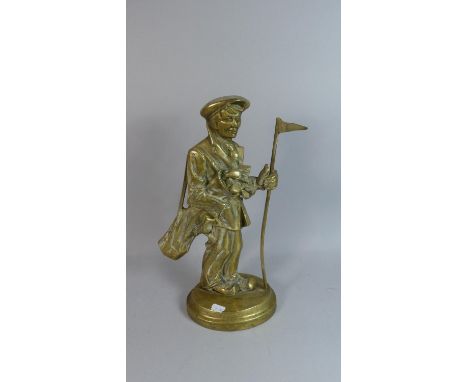 A Figural Brass Door Stop in the Form of Caddy Carrying Golf Bag and Clubs and Holding Flag, 38cm High 