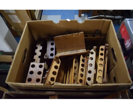 A Box Containing Various Treen Pipe Racks and Stands 