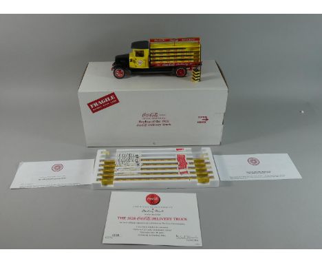 A Mint Boxed Detailed 1:24 Scale Replica of the 1928 Coca -Cola Delivery Truck with Coke Bottles and Trolley. Certificate of 